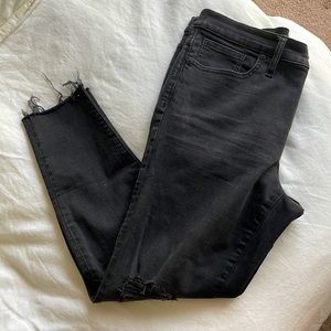 Madewell Black Skinny Jean with knee rip and raw hem